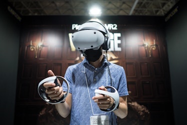 CHIBA, JAPAN - SEPTEMBER 15: An attendee wearing a Sony PlayStation VR2 (PS VR2) headset plays the B...